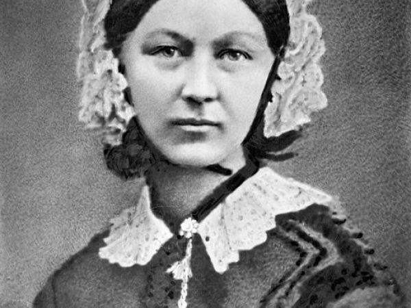 black and white photo of a young florence nighingale in a lace cap