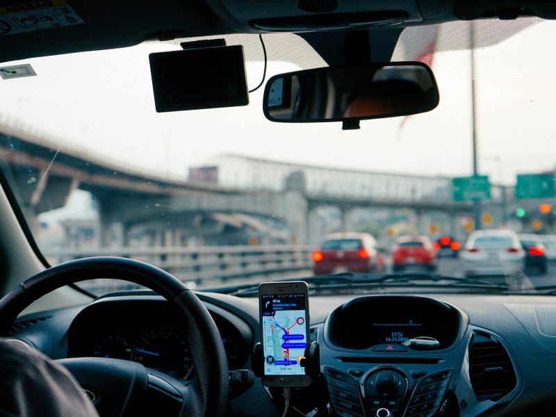 View through a windscreen of driving on an urban road
