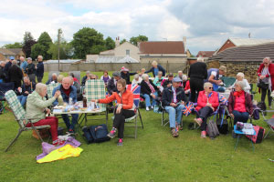 Groups of people sitting and eating