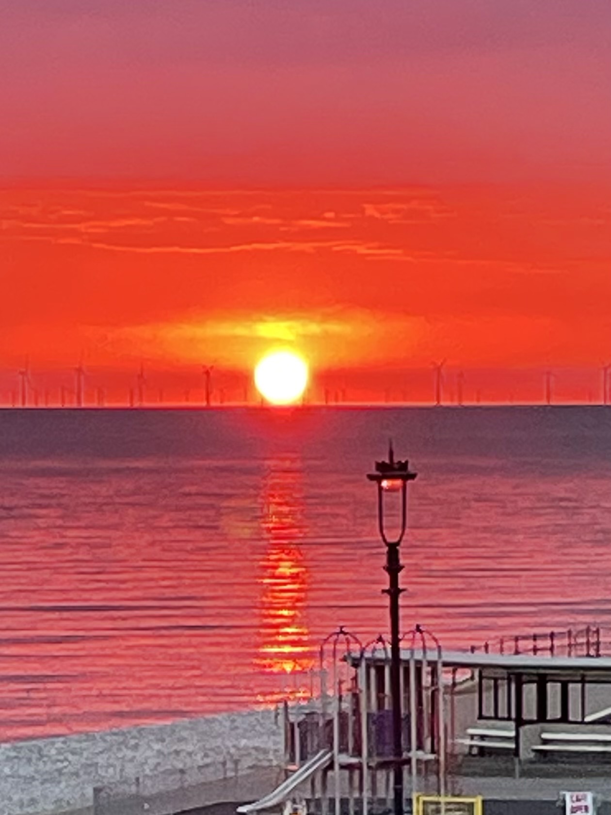 Photo of a sea at sunrise