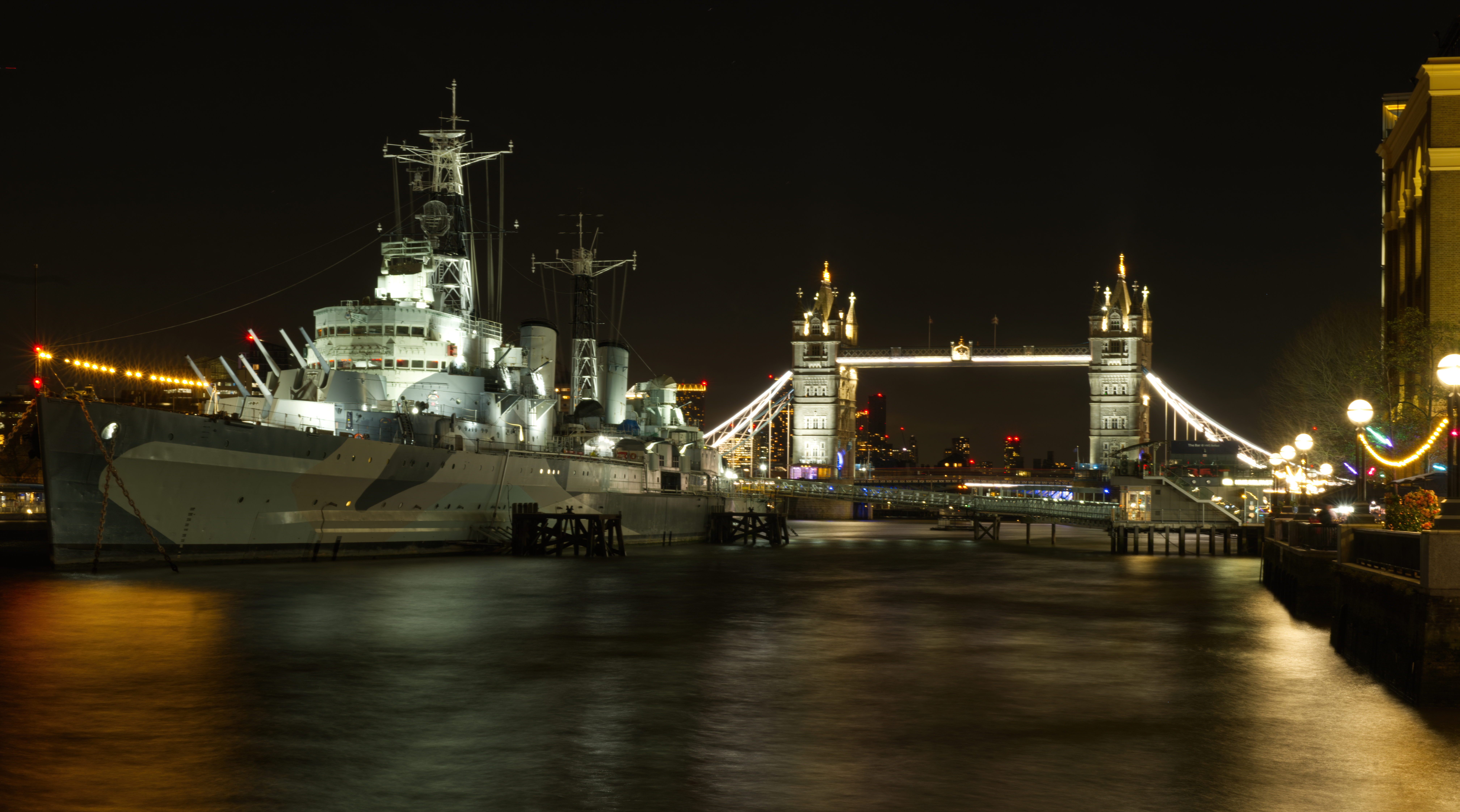 Photo of HMS Belfast and Tower Bridge at night