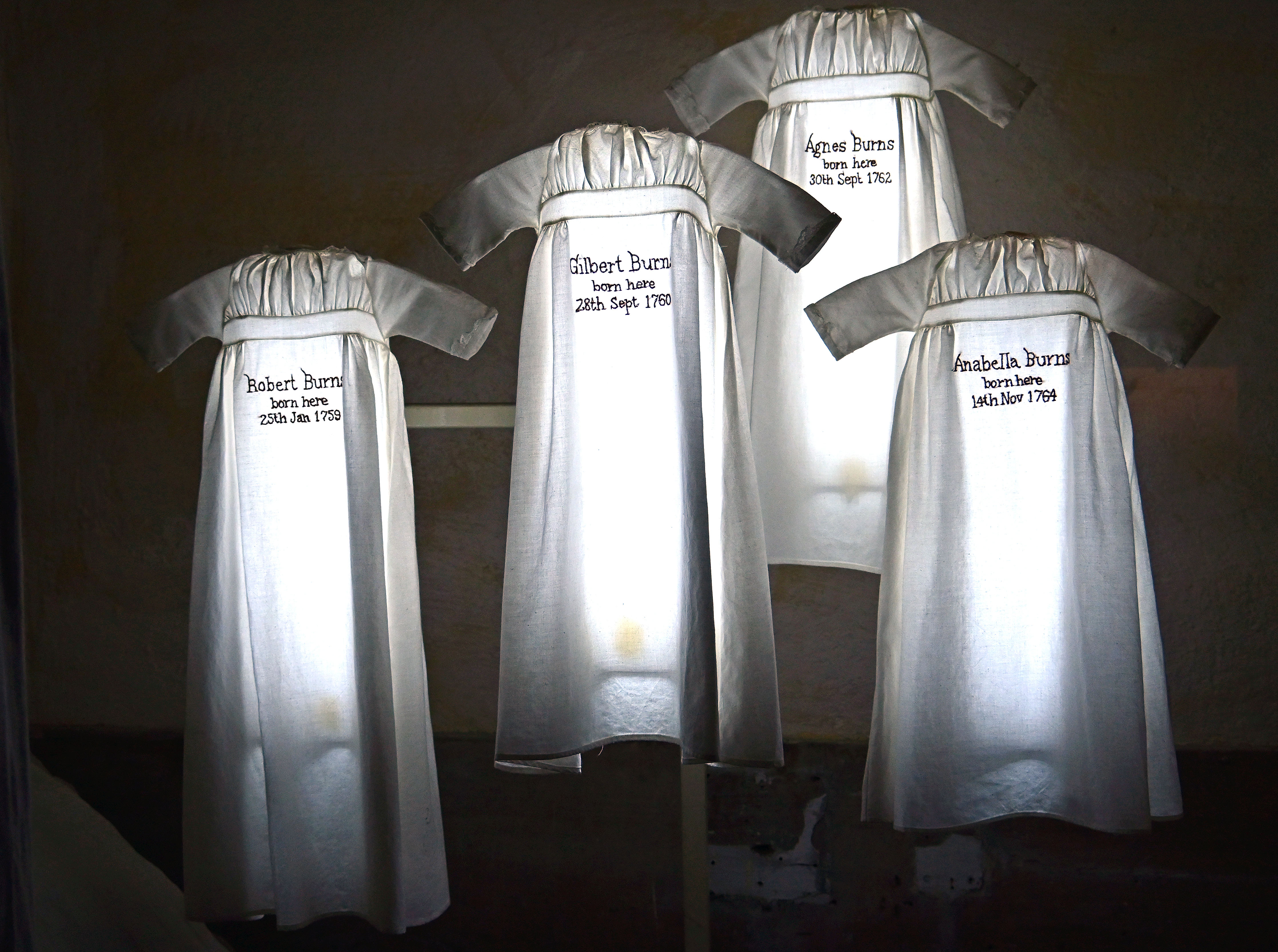 Photo of illuminated nightdresses - a display with quotes from Robert Burns
