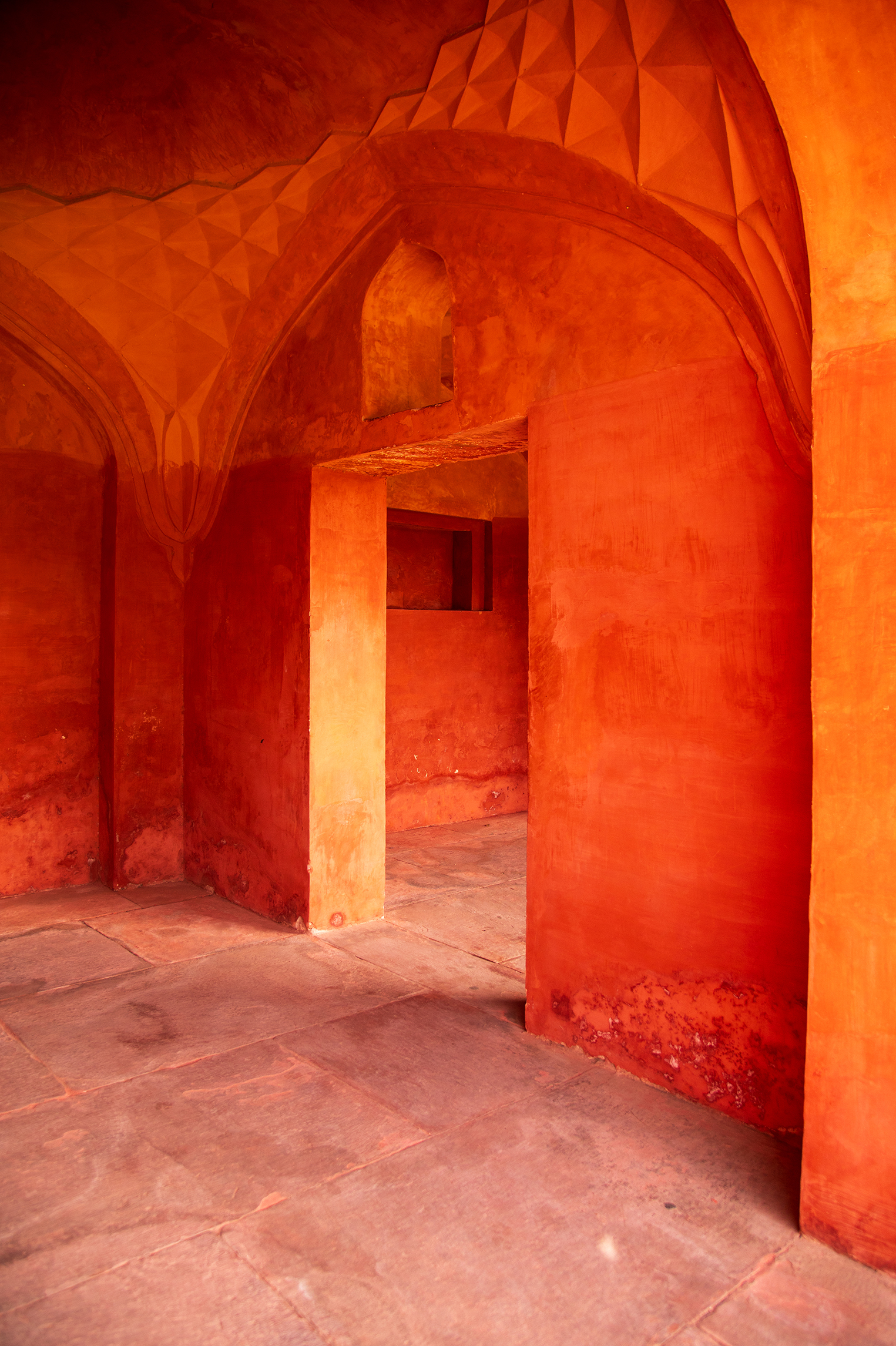 Photo of an orange doorway inside the Taj Mahal