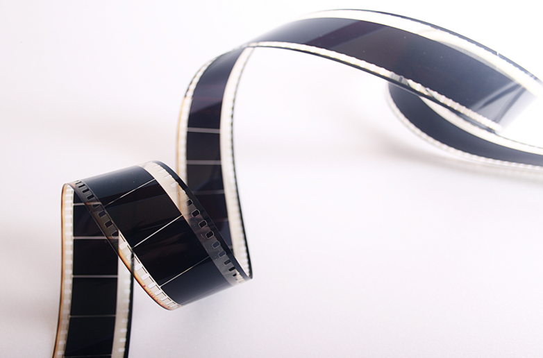 some film winding up on a white background 