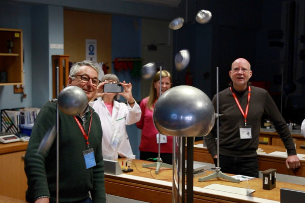 Members watching a static electricity plasma ball result in tinfoil muffin cases flying through the air