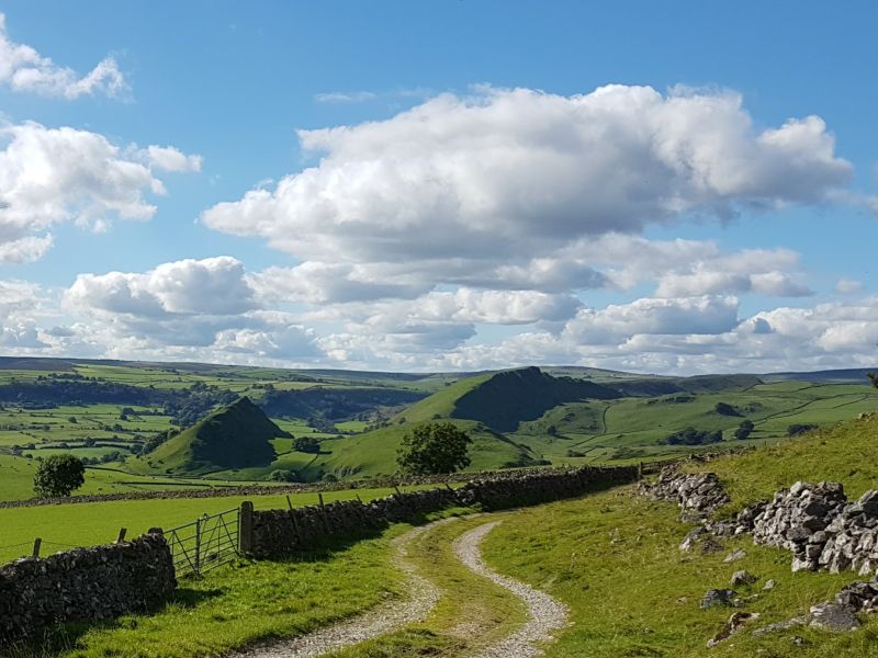 Photo of a path leading into hills