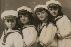 A black and white picture of four children