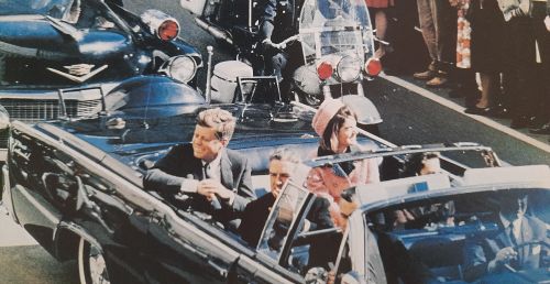 Photo of President Kennedy in open topped car